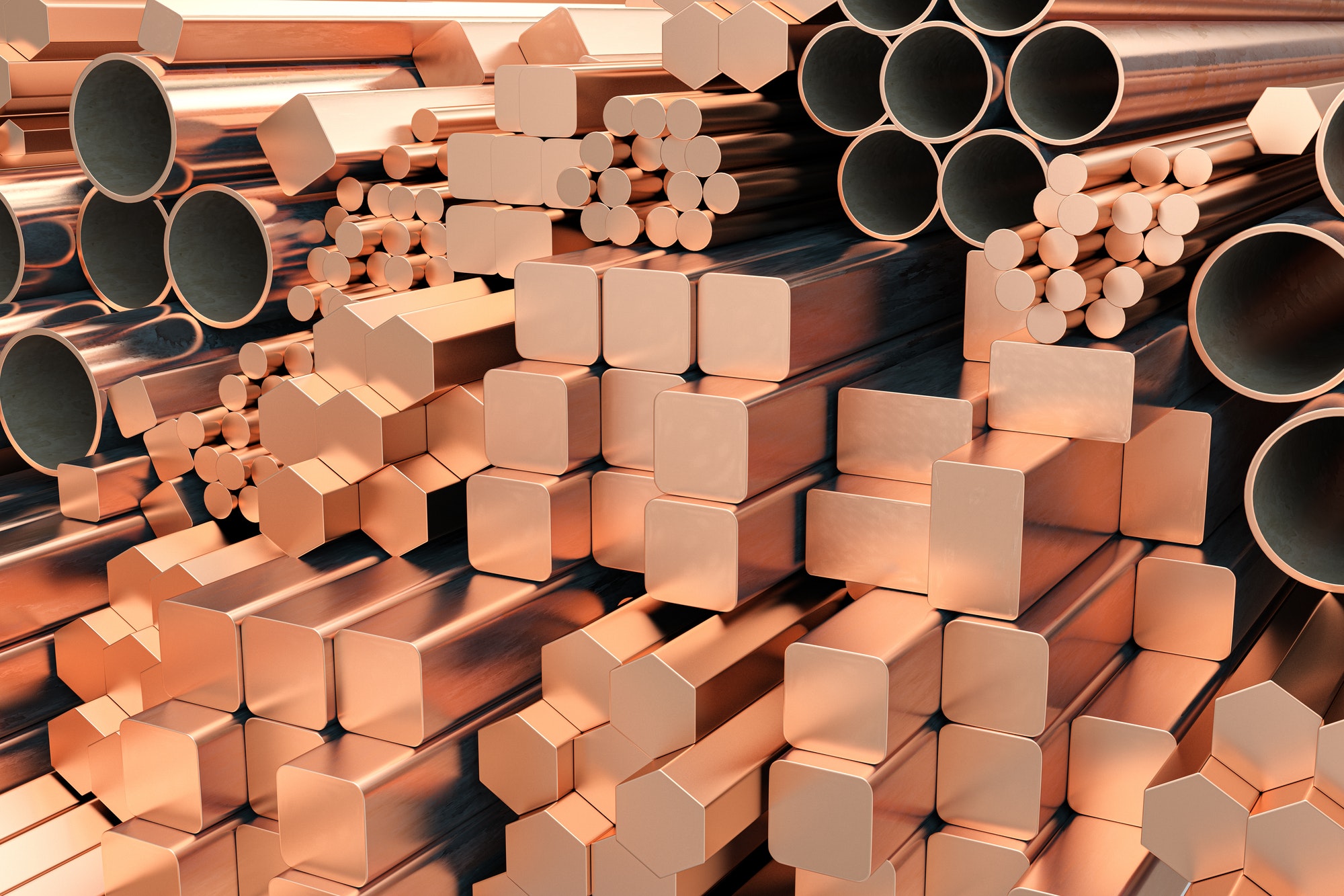 Copper tubes and different profiles in warehouse background. Different copper metal rolled products.